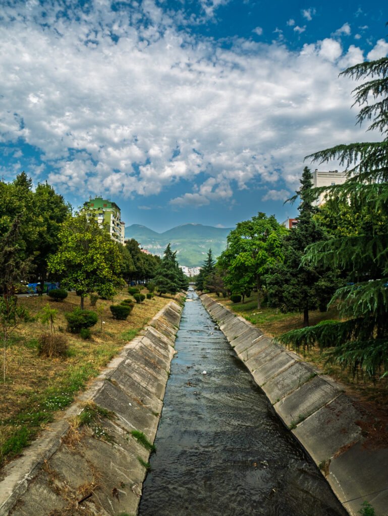 Smelly but beautiful canal leaving Tirana into the mountain range 