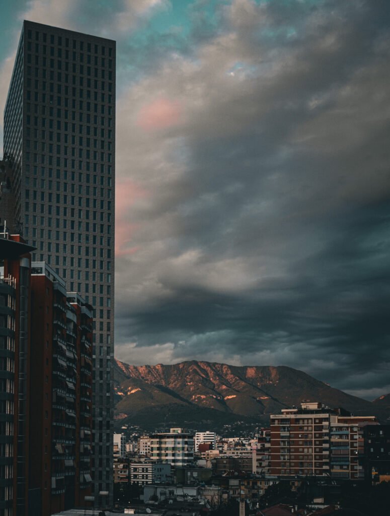 Stunning sky with mountains panorama and skyscraper in Tirana Albania 