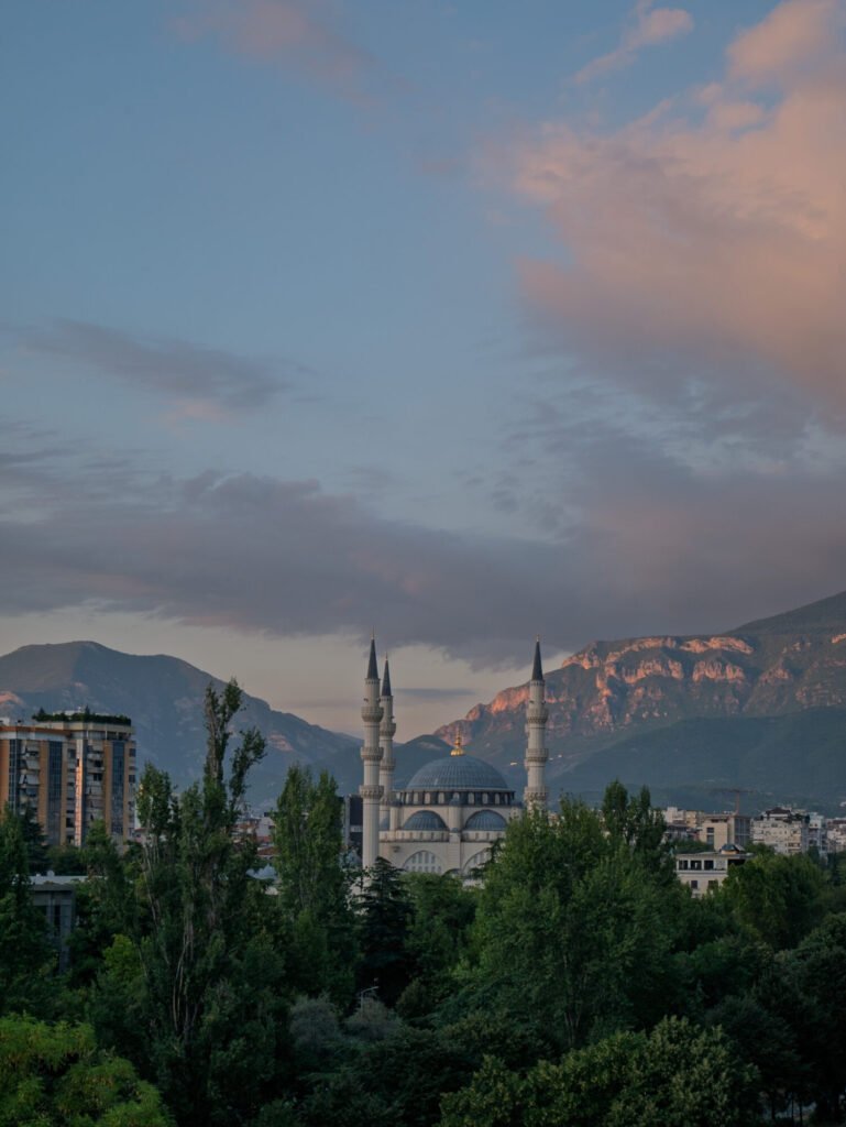 Sunset over Tirana with the mountains and the mosque in the background 
